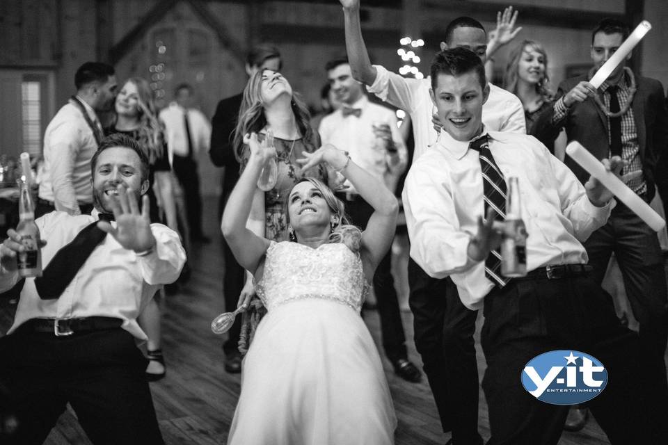 Bride dancing with her bridesmaids