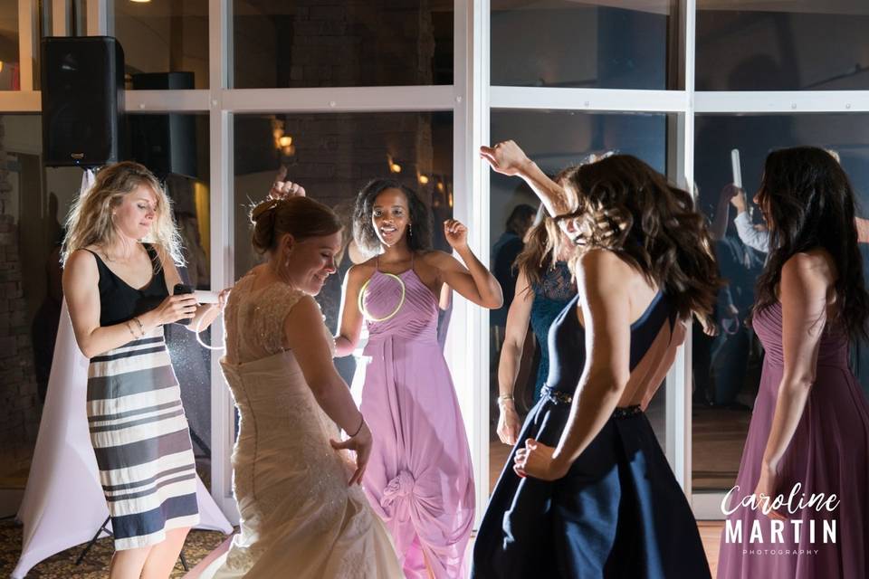 Bride dancing with her bridesmaids