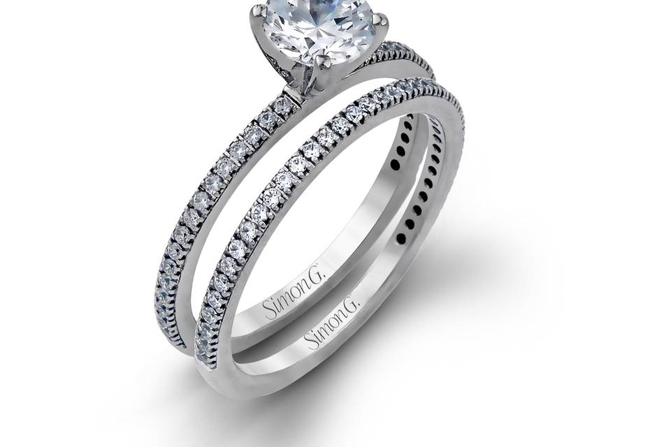 Style PR108 <br> The classic, streamlined design of this 18k white gold wedding set is accented by .30 ctw of sparkling white round brilliant diamonds.