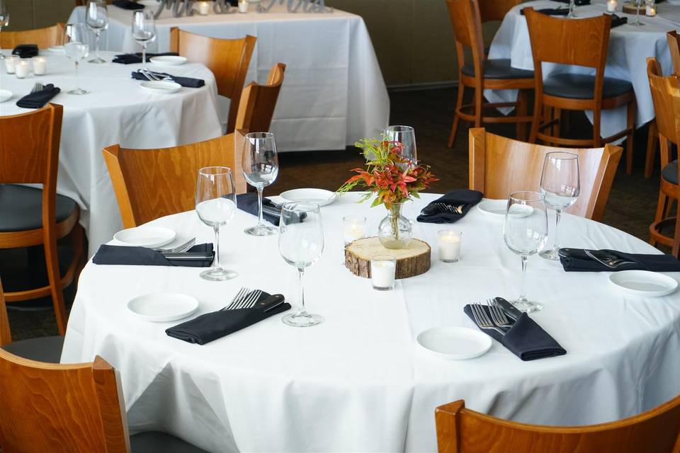 Close-up of a round, linen-covered table