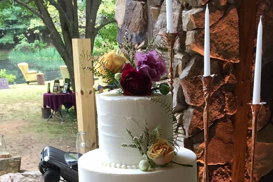 Textured white cake with flower decorations