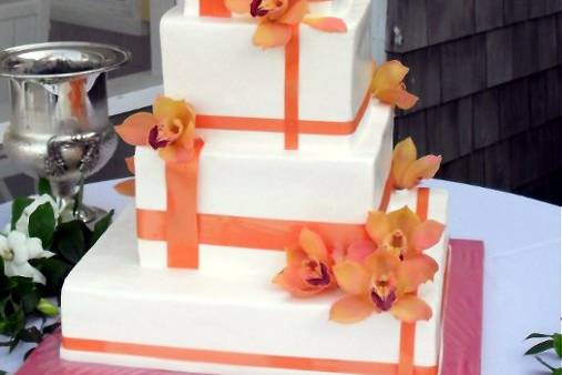 Square cake with orange decorations