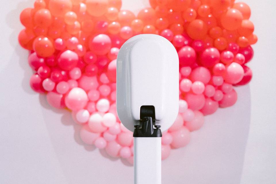Booth with balloon backdrop