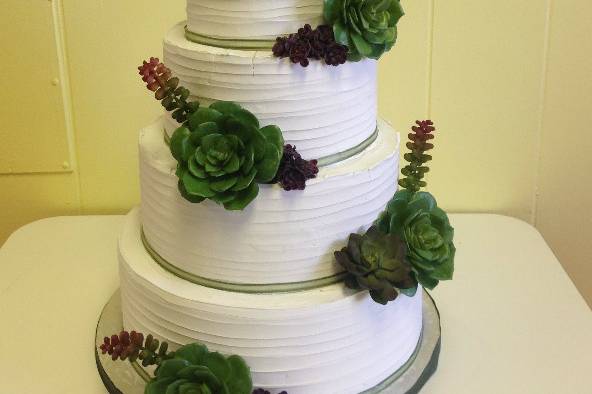 4-tier wedding cake with initial