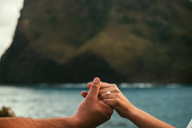 Holding hands by the ocean