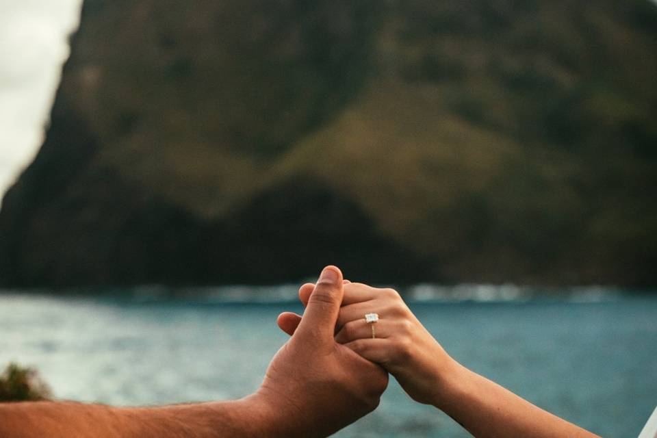 Holding hands by the ocean