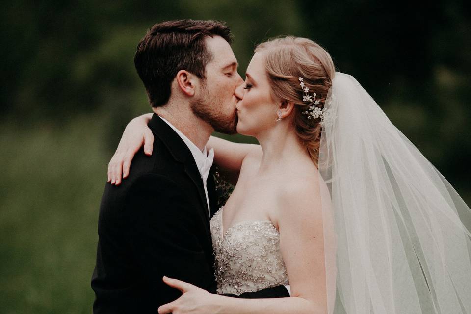 Assisting the bride with her dress