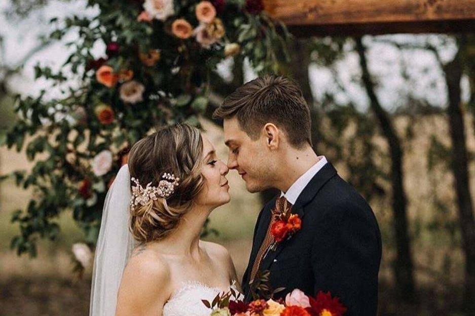 Groom holding his bride