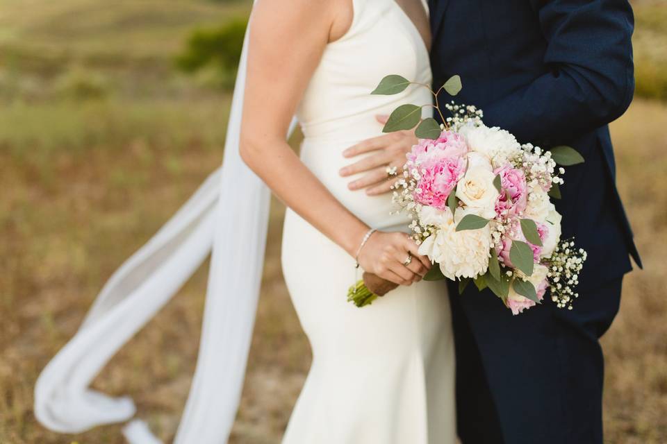 Closeup of couple and bouquet