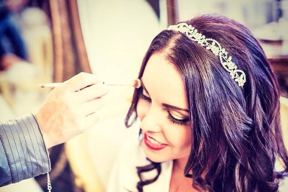 Applying the bride's makeup