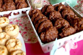 Rustic and romantic dessert table featuring cranberry chocolate chunk cookies, peanut butter bars, and mini cupcakes.