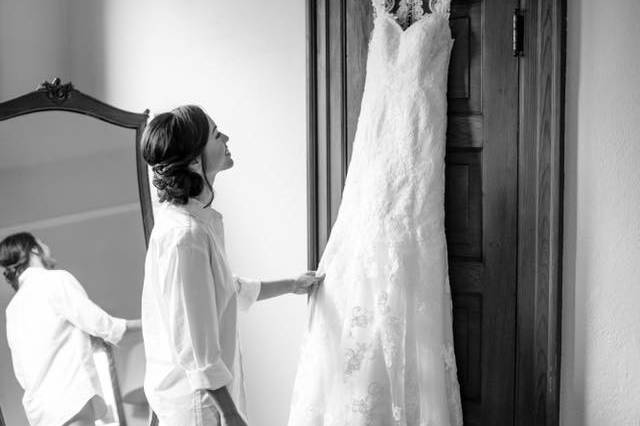 Bride looking at her wedding gown