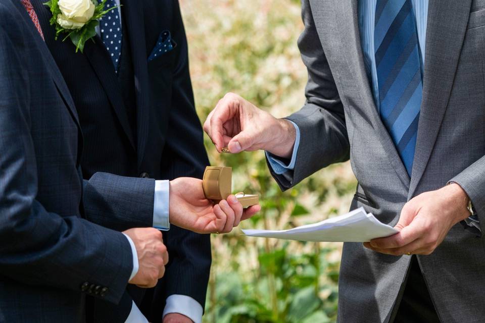 Officiant examines ring