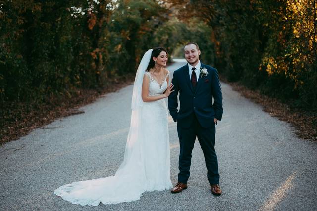 Newlyweds posing outside