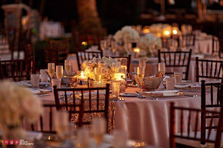 A soft glow during this blush and gold wedding reception