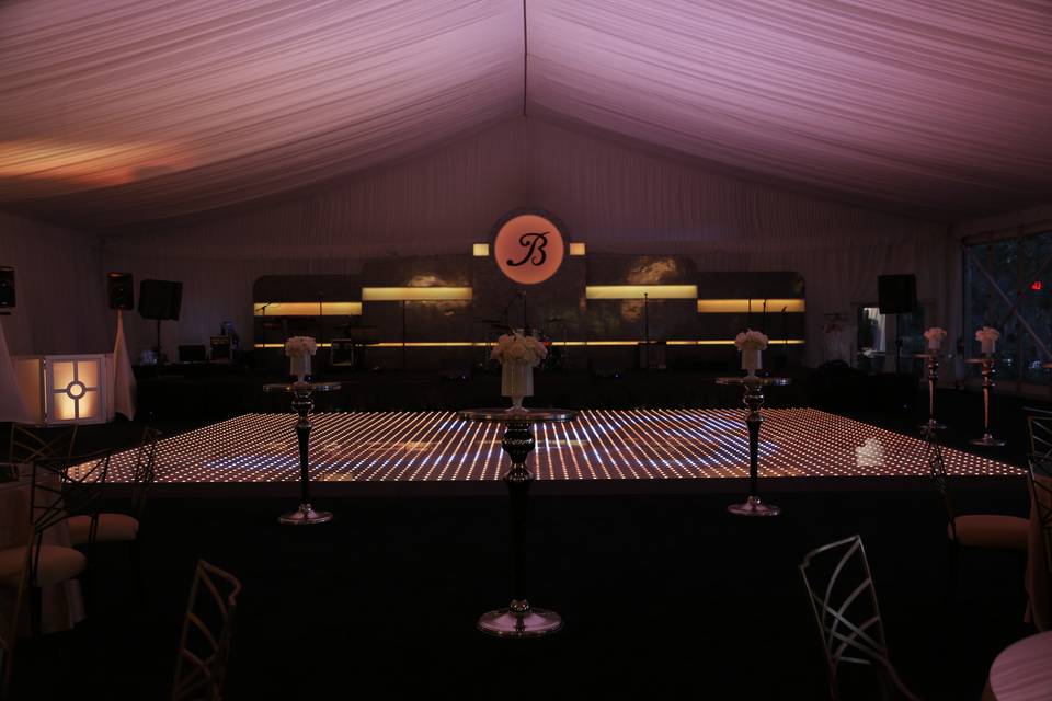 The pixel dance floor with your monogram and custom stage set will bring the party to life.