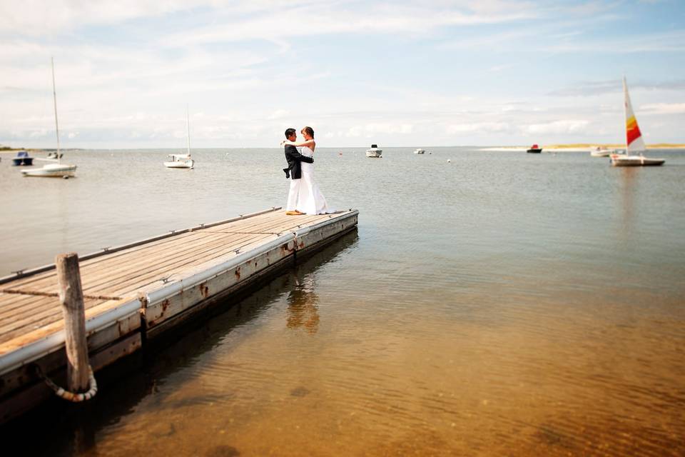 Couple posing on a dock