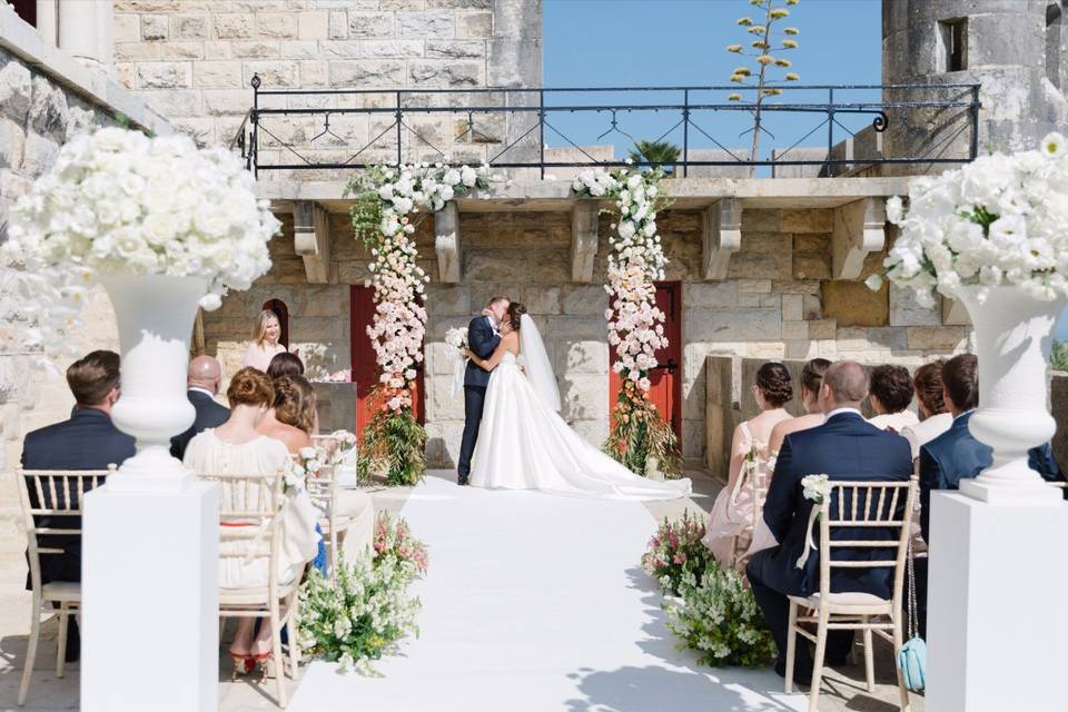 A sunlit courtyard ceremony