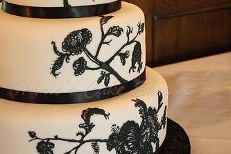 3-tier round fondant with hand piped design from invitation