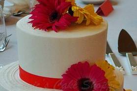 2-tier buttercream with Gerber Daisies