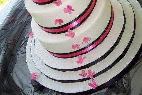 3-tier fondant with pink fondant butterflies & black/fushia ribbon