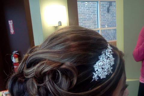Wedding updo with silver accessory