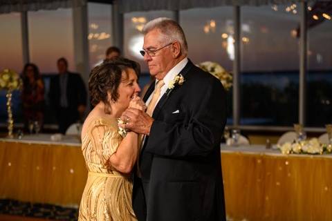 Bride and groom adorned in gold