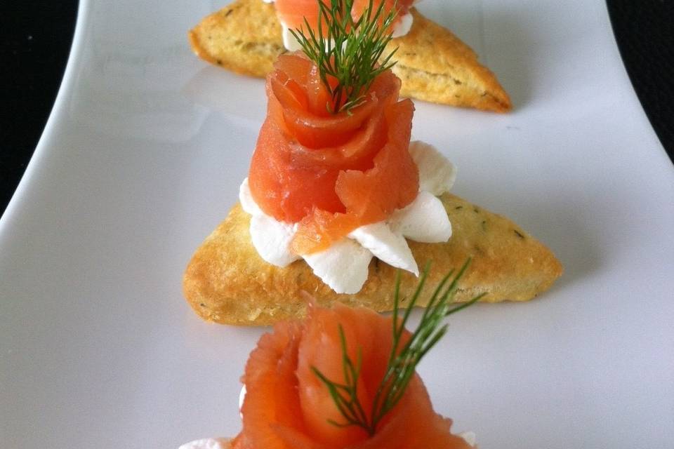 Canape with smoked salmon flower and goat cheese on jalopeno mini scone www.aristacatering.com