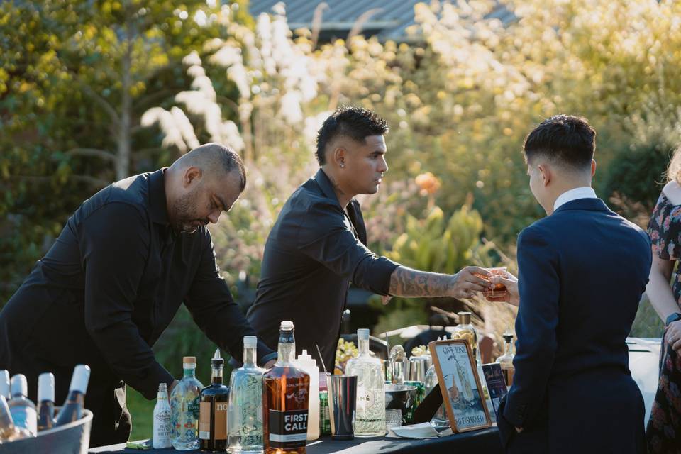 Wine at the beginning of a reception ready for the guests exiting the ceremony.