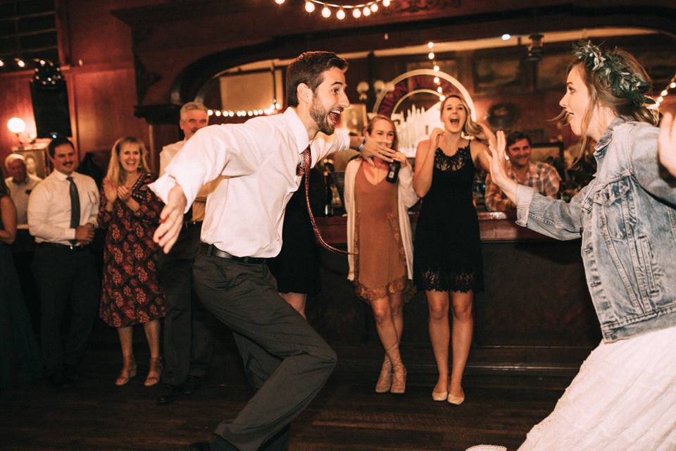 Bride swinging with guest