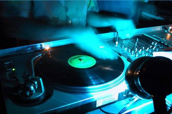 Scratching on the turntables.  Many of the DJs at Dash Entertainment us real vinyl or CD turntables to mix and scratch.