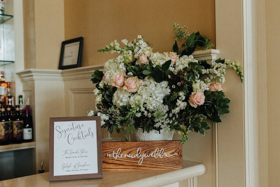 Sign and lovely floral arrangement
