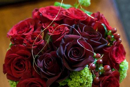 Red roses and lime green, whimsical golden line, the formal bouquet