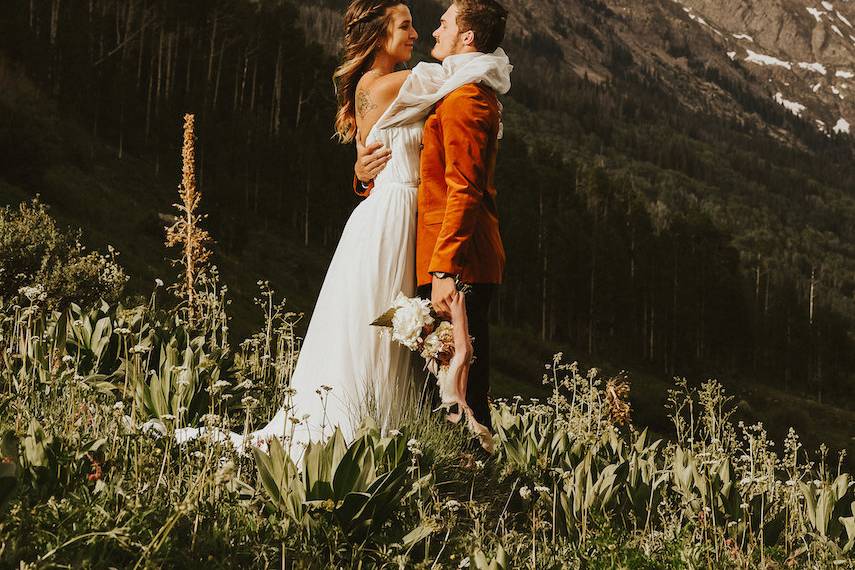 Bride and groom embrace