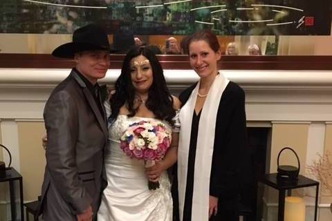 The couple with the officiant