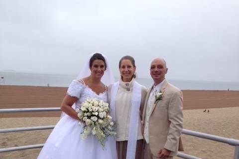 The couple with the officiant