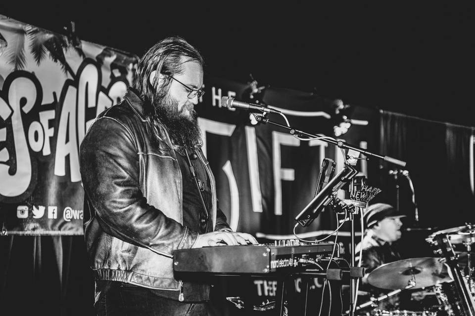 Tim on keys and saxophone