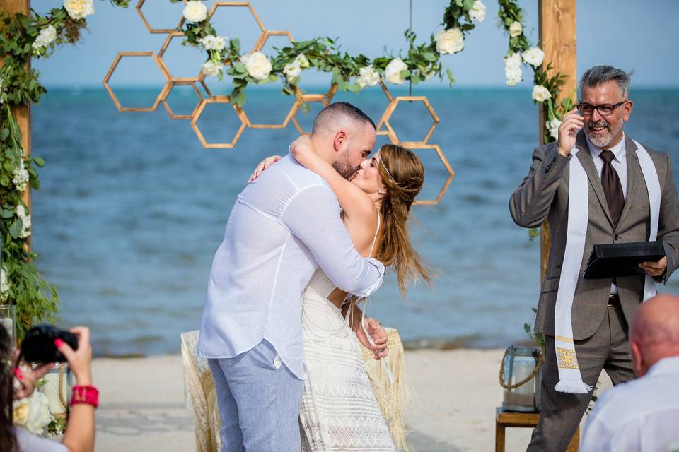 Boho chic beachside ceremony featuring our Valerie structure