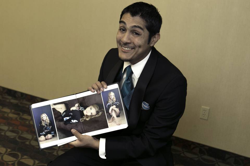 Grooms Reaction to seeing a surprise boudoir book.  Fresno, Wedding photography