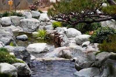 The Garden features many special details such as the hand washing fountain, hand-crafted bridges, a waterfall and a relecting fountain. Photo Credit: Rengie Mendoza Photography. He can be found on WeddingWire.com.