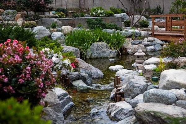 The Garden features a 170' stream that flows from a waterfall at the top of the Garden and ends in a calm pond at the bottom.  Photo Credit: Rengie Mendoza Photography