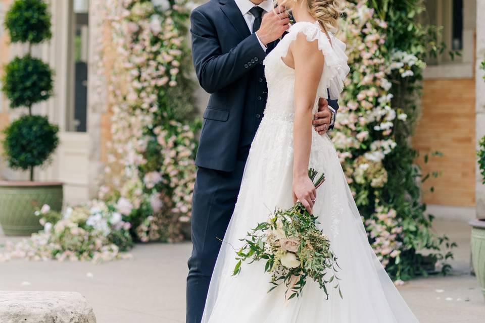 Kiss under a floral arch