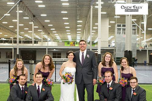 The couple with the bridesmaids and groomsmen