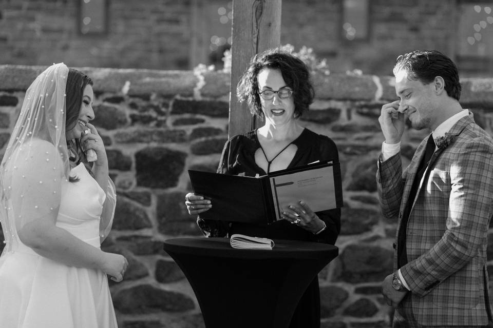 Couple crying during ceremony