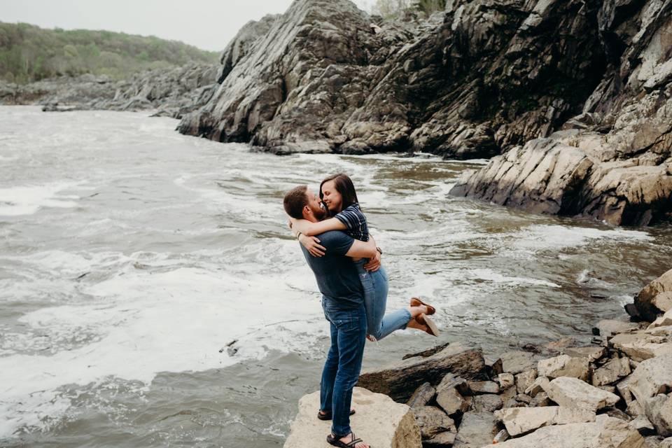 Happy couple by the water