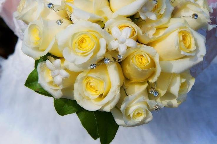 Champange Roses Accented diamonds and pearl tipped pin.Tara send us this picture with the following note.Hi! i just wanted to send you a pic of the bouquet from the wedding! Thank you again for the beautiful arrangement! Tara