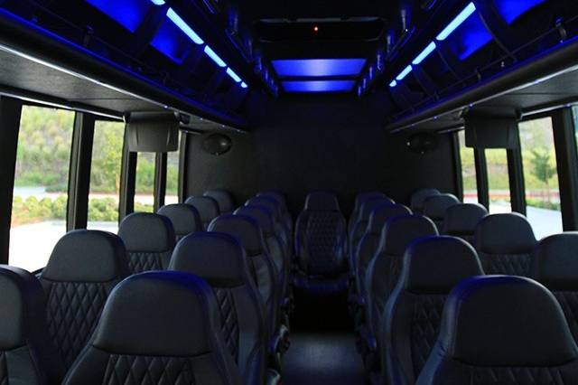 28 Passenger Executive Shuttle Bus Interior with plenty of overhead storage.