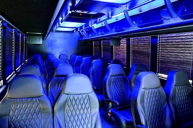 Executive Shuttle Bus with Interchangeable lighting (White, Blue, and individual reading lights).