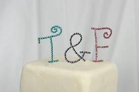 This is a stunning custom crystal cake topper which can be personalized with your choice of font and crystal colors. Monogram cake toppers are extremely popular!