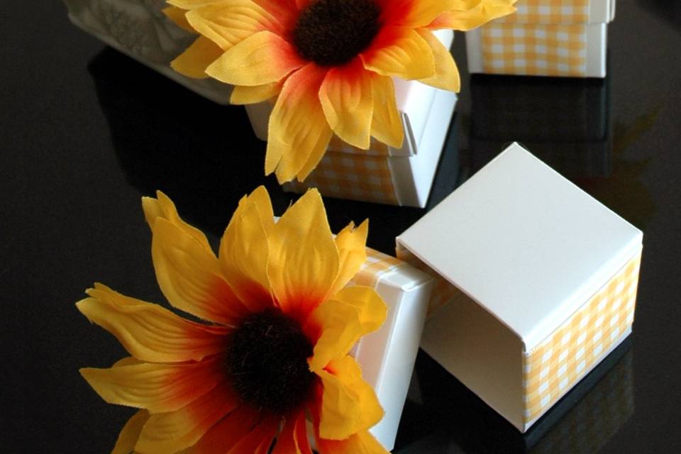Sunflower Wedding Favor Boxes
Perfect for a spring wedding or garden affair!  These adorable sunflower favors feature a crisp white box wrapped in gingham ribbon and topped with a sunflower. Fill them with your favorite candy or treat for an added special touch!
Advantage Bridal is pleased to offer fast shipping and a low price guarantee.